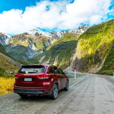 Car driving through Fiordland New Zealand