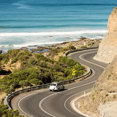 Car travelling along the world famous Great Ocean Road, Victoria, Australia