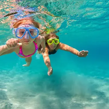 Kids Snorkelling in the ocean in Australia