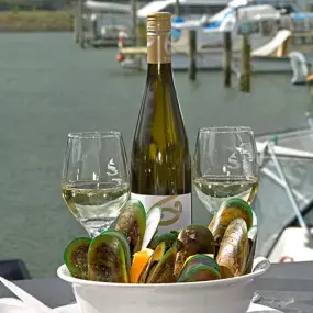 Bottle of wine and New Zealand green lipped mussels