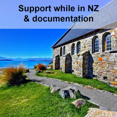 Church sitting on shores of Lake Tekapo under blue sky