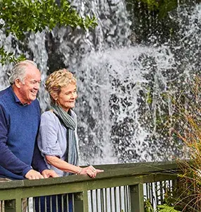 Couple looking at a waterfall