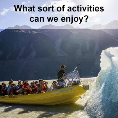 Visitors exploring icebergs on glacier lake in Mt Cook National Park