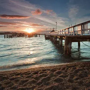 Sun setting over the ocean in Russell