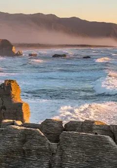 View of Pancake rock near Punakaiki druing sunrise, New Zealand