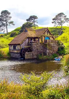 Image of a water mill and pond in Hobbiton