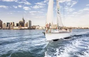 Sailing boat on the water with Auckland Skyline in the background