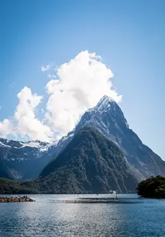 View of Milford Sound and snowcapped mountains in Fiordland National Park