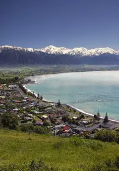 Aerial view of Kaikoura and the snowcapped mountain in the back