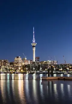 View of Auckland skyline and iconic Sky Tower at night