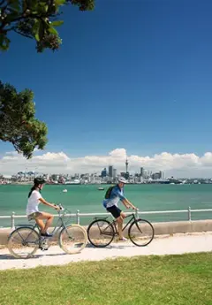 A couple cycling on a cycle path in Auckland