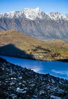 View of snow-capped mountains of the Remarkables mountain range and Queenstown