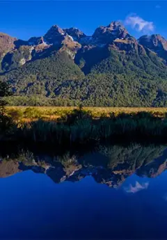 Mountains reflection in Mirror Lake in Fiordland National PArk