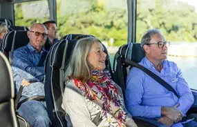 Guests enjoying the comforts of the Grand Pacific Coach