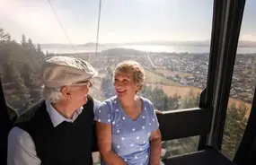 Couple enjoying the gondola ride to Rotorua Skyline