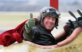 Pilot in the front seat of a war plane