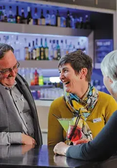 Grand Pacific travellers enjoying a drink at the hotel bar