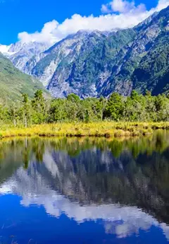 Mountains above a lake in Franz Josef