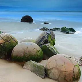 Visit the unique formations of the Moeraki Boulders