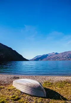 Image of a boat by Lake Wakatipu near Queenstown