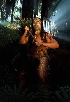 Māori warrior in traditional attire surrounded by forest.