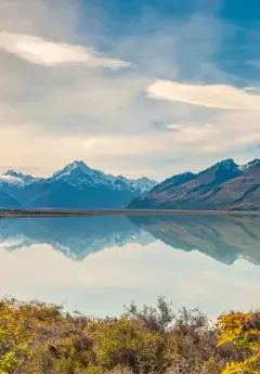 Mt Cook and surrounding mountains reflect off Lake Pukaki