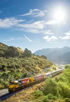 TranzAlpine train alongside Waimakariri River