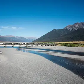 The TranzAlpine Train crossing the Waimakariri Bridge